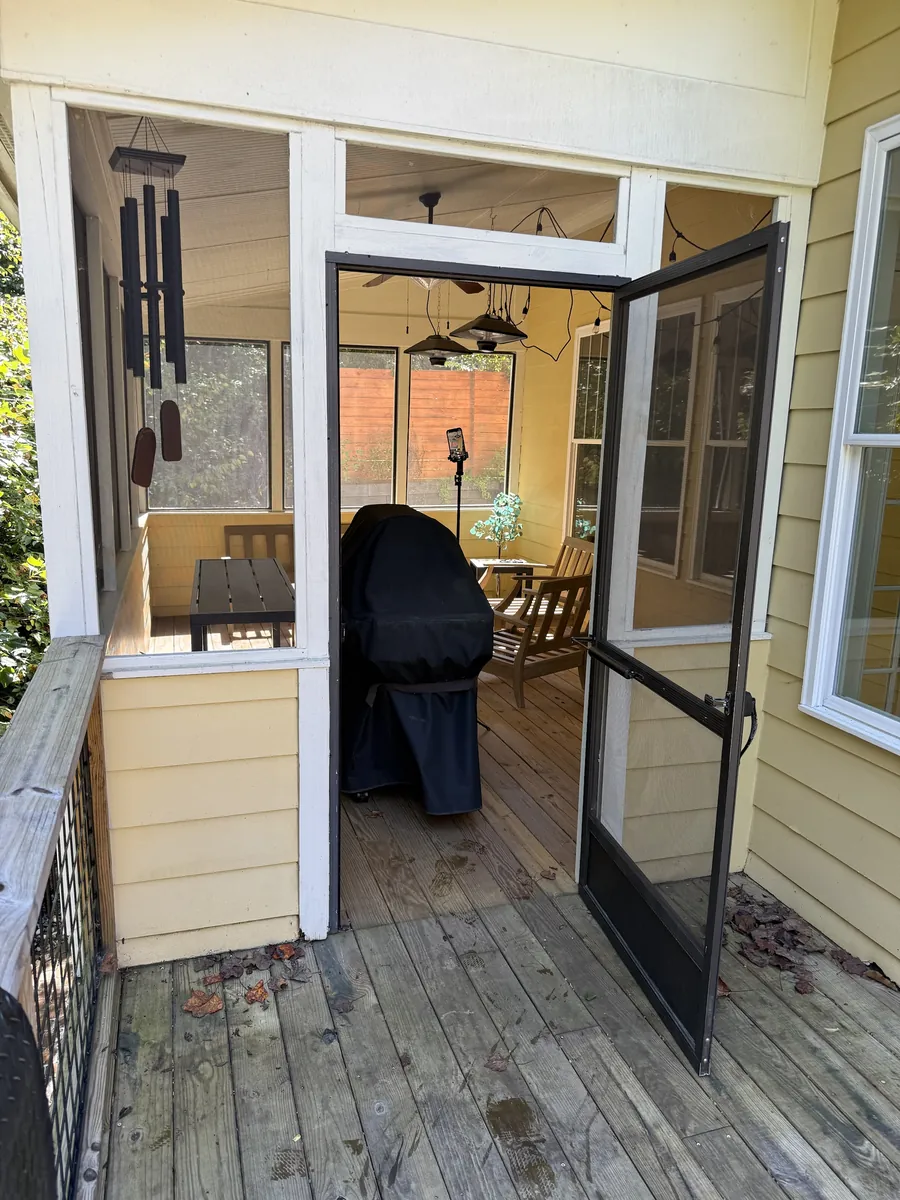 Screened porch entry before cleaning